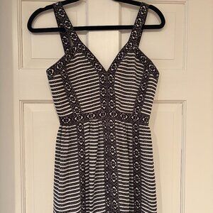 This is a BCBGMAXAZRIA Melania dress with an ivory/black striped and geometric p
